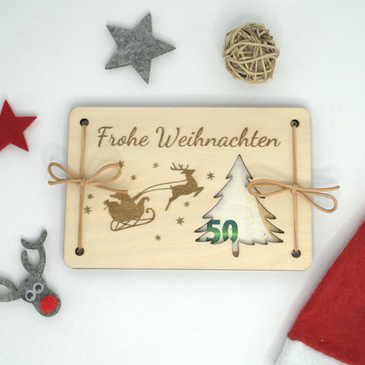 Weihnachtliches Geldgeschenk aus Holz mit Geldschein im Tannenbaum-Ausschnitt