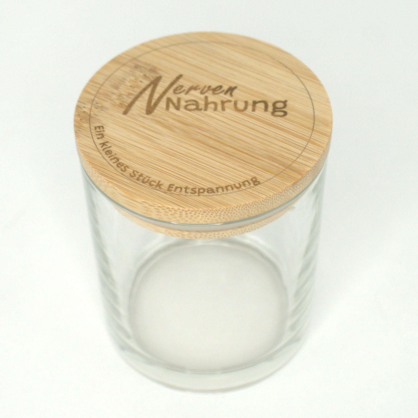 Leeres Kerzenglas mit graviertem Bambusdeckel Motiv Nervennahrung