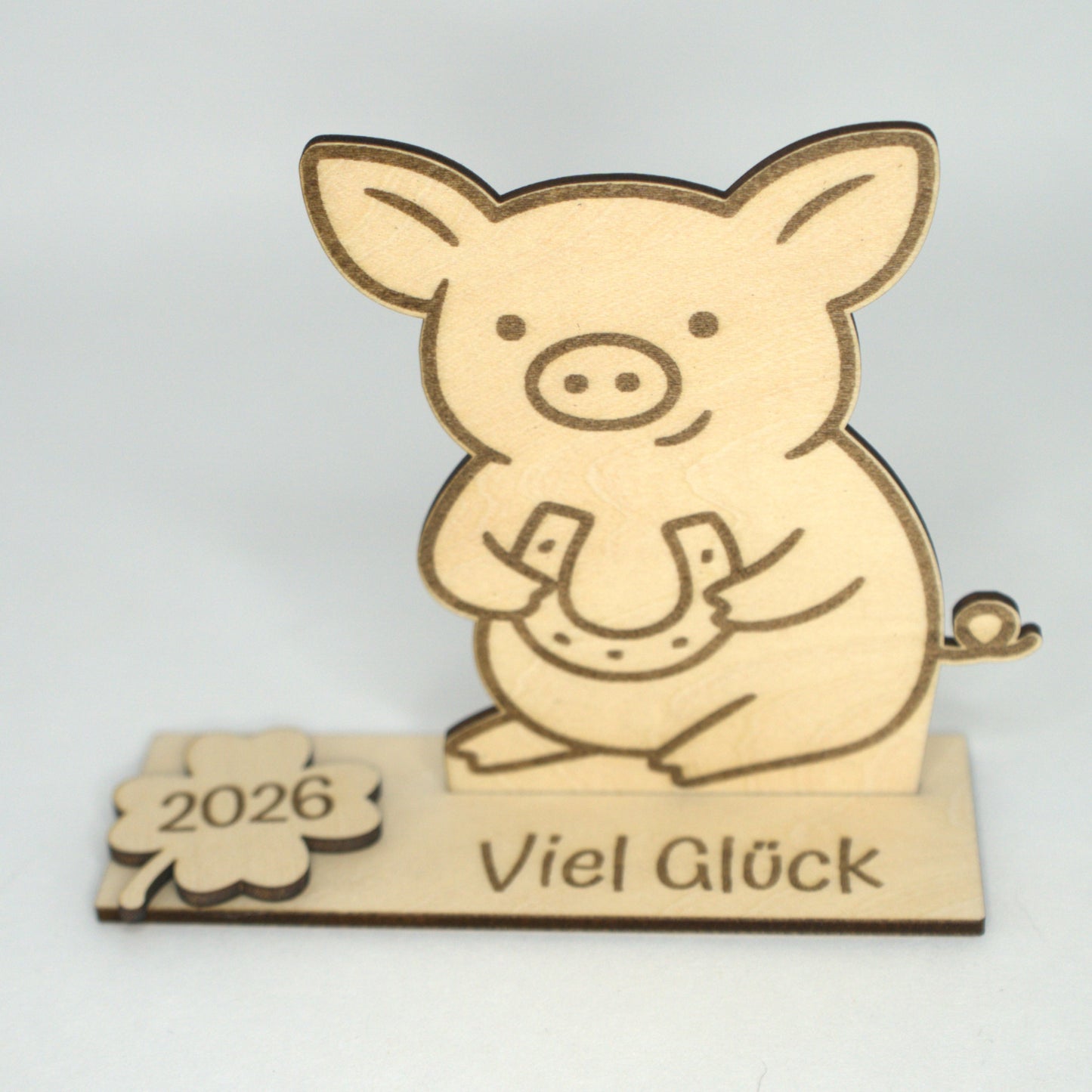 Holz Glücksschwein mit Hufeisen auf Grundplatte mit Kleeblatt